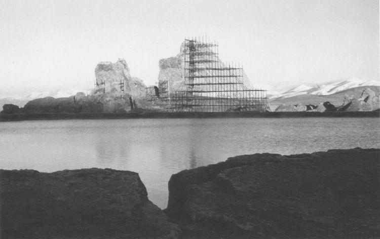Fig. 88. View of the West Iwan of the palace at Takht-i Sulaiman, Iran, with the lake in the foreground