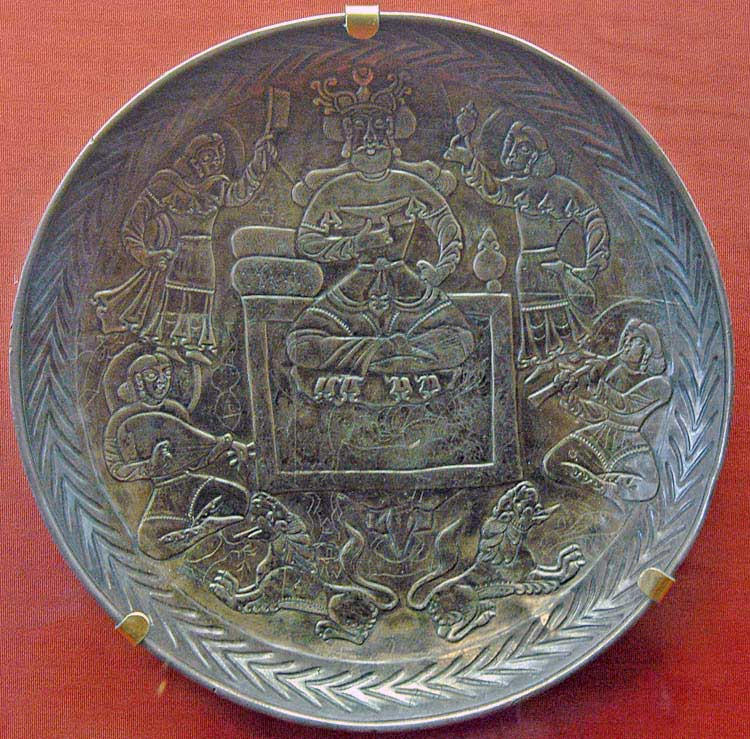 Post-Sasanian silver-gilt plate from the Kama region. Enthroned ruler drinking with attendants and musicians. Central Asia or Eastern Iran, 7th to 9th centuries.